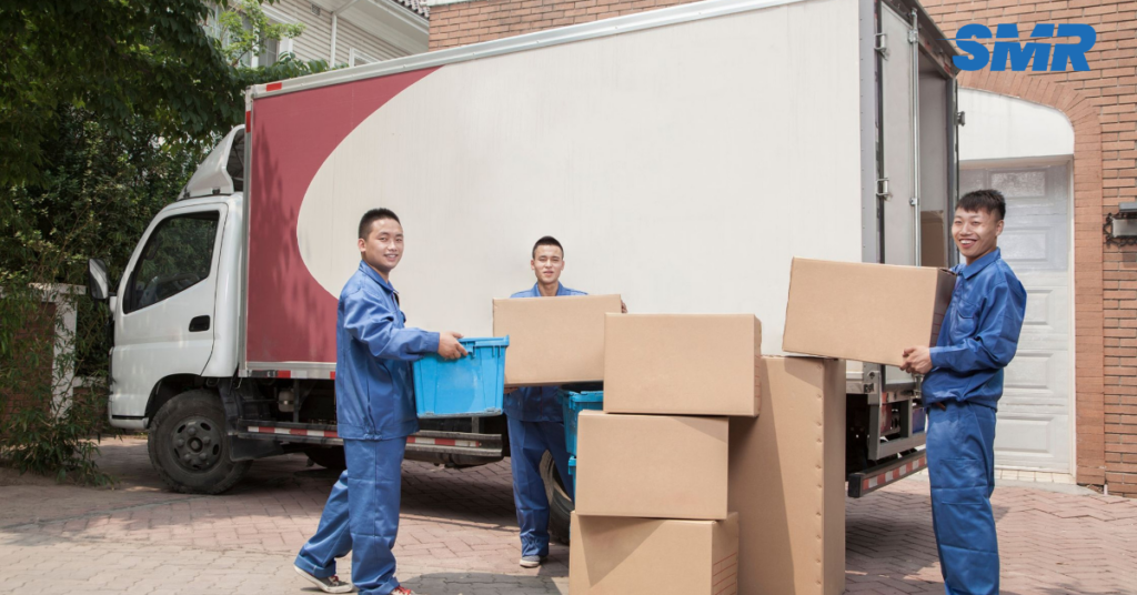 Man and Van service in Thamesmead loading moving boxes into a van