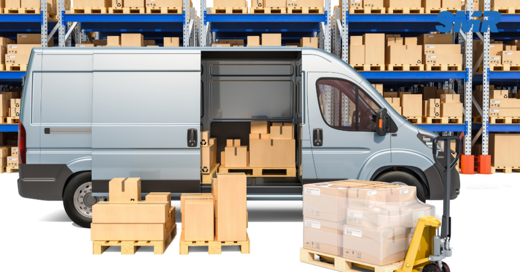 Van loading boxes for a home or office move in Thamesmead, with items in a warehouse