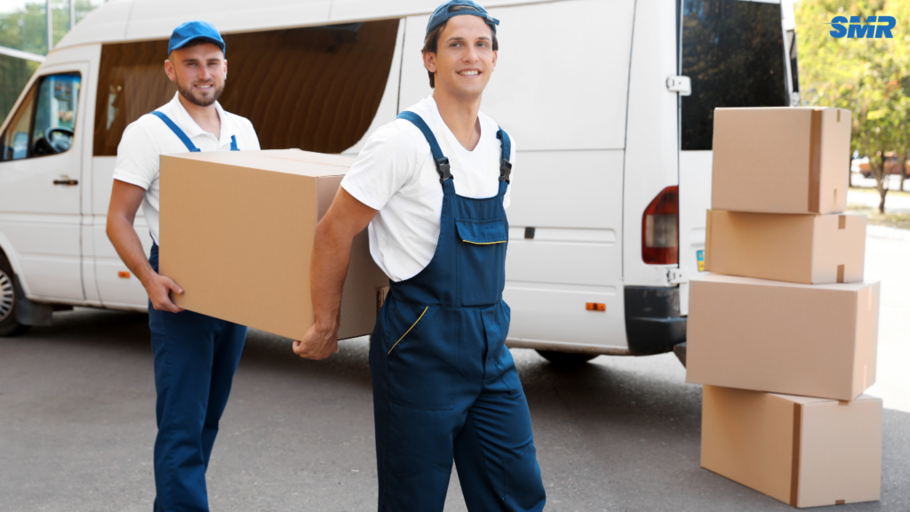 House removals Harrow movers carrying sofa into property HA1