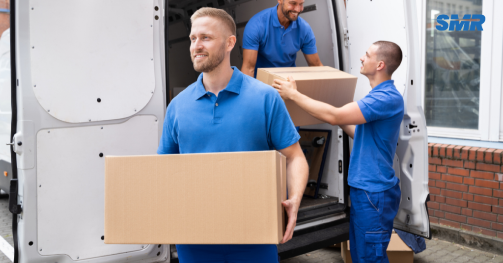 man with a van Brixton cheap movers lifting sofa carefully inside a home