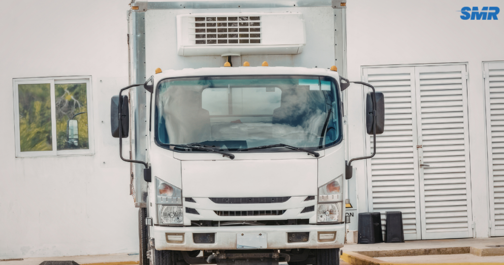 Professional man and van Southgate N14 team loading boxes into a removals van