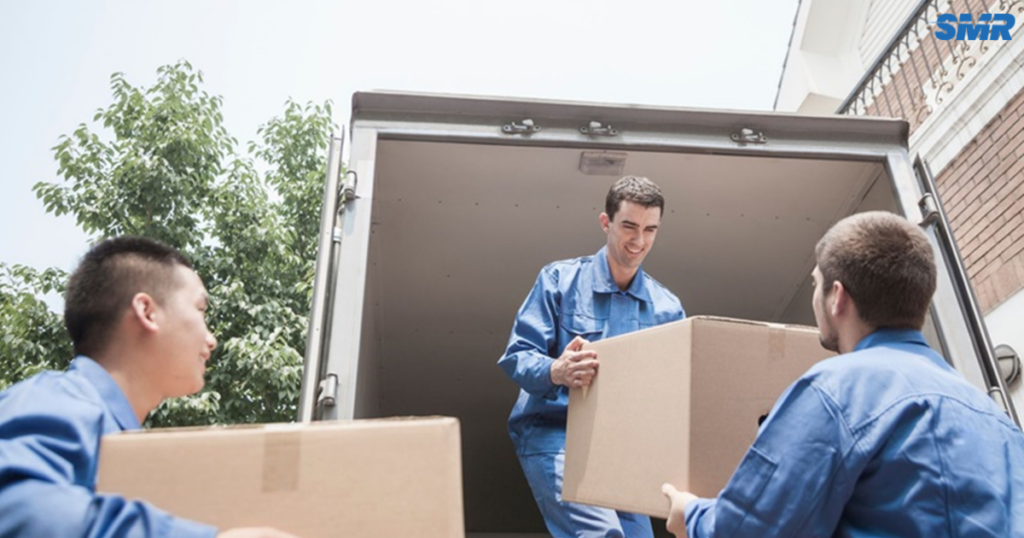 man and van Chelsea team loading furniture into removal van London