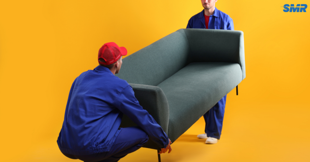 Man and van Bexleyheath DA7 team moving furniture outside home with branded van and happy customer