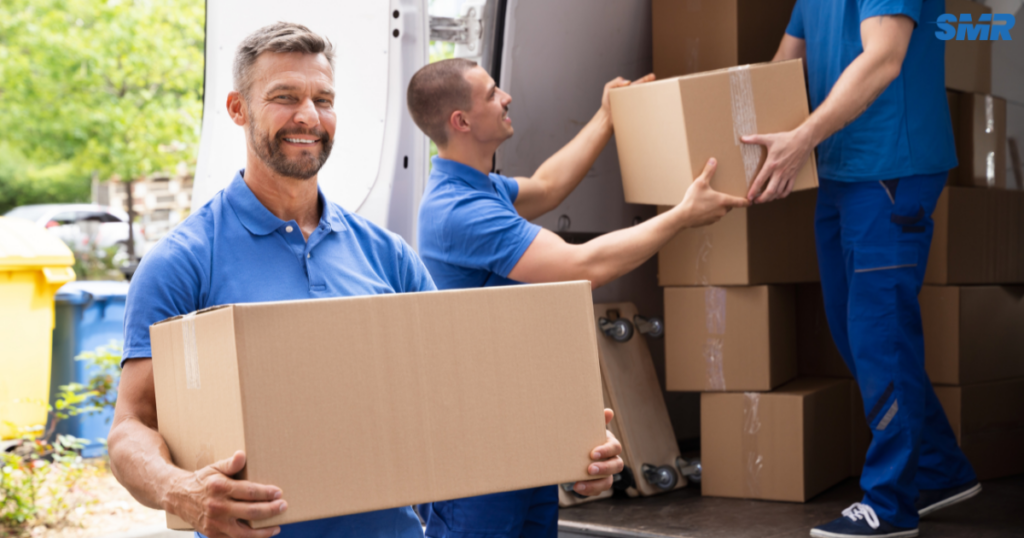 cheap man and van Ealing same day removals service with movers loading furniture into a van