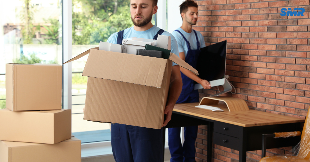 Man and Van Fulham movers loading furniture into removals van in SW6