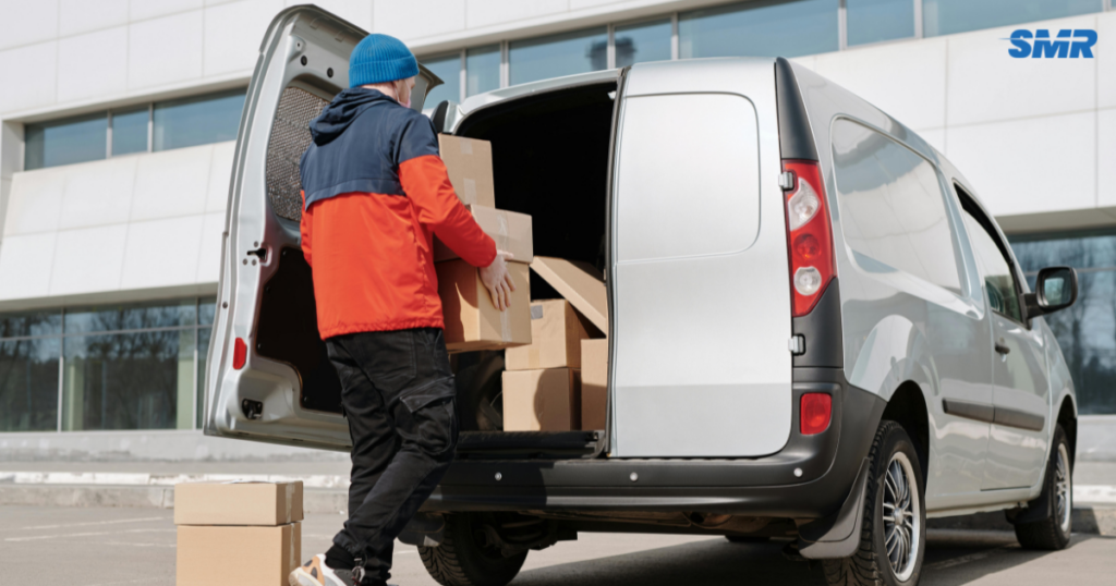 Office removals Hornchurch Cheapest movers loading office furniture and boxes into van