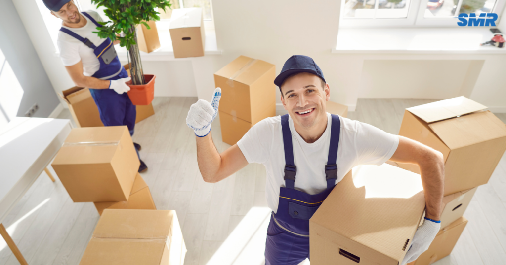 Man and van for single item Golders Green movers carrying sofa into flat