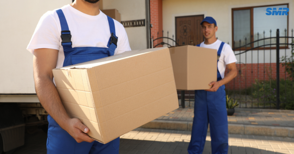 Office removals Hornchurch movers loading office furniture and boxes into a van
