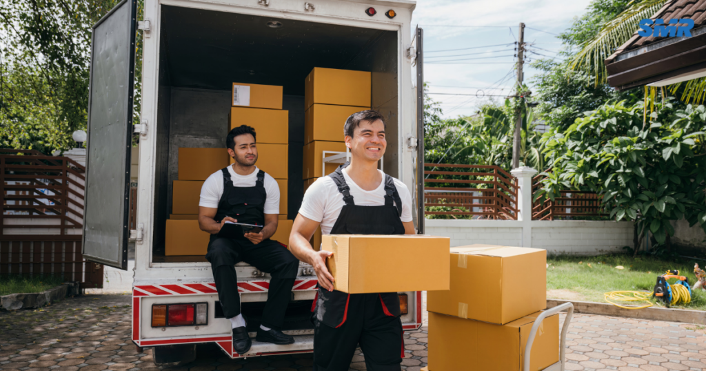 Man and Van Kensal Green movers loading boxes into a removals van in NW10