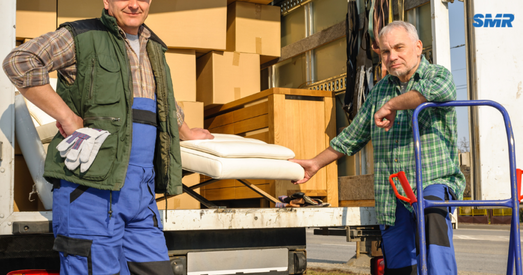 Office removals Islington Cheap movers loading office furniture and boxes into van