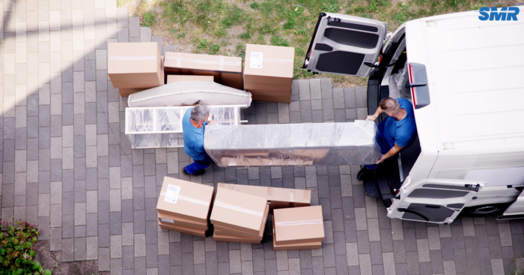 cheap man and van Catford same day removals service with professional movers loading furniture into van