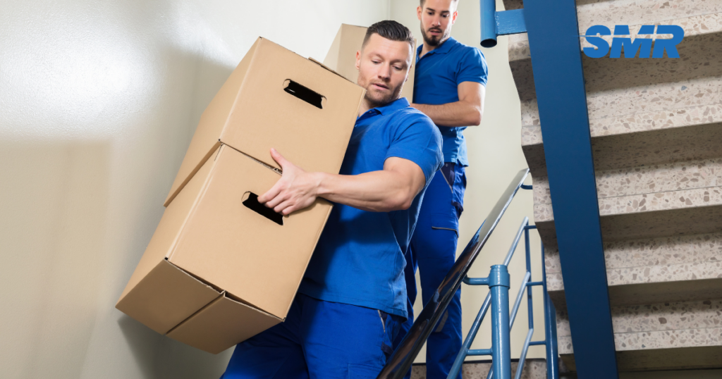 man with a van Gospel Oak cheap movers lifting sofa carefully indoors