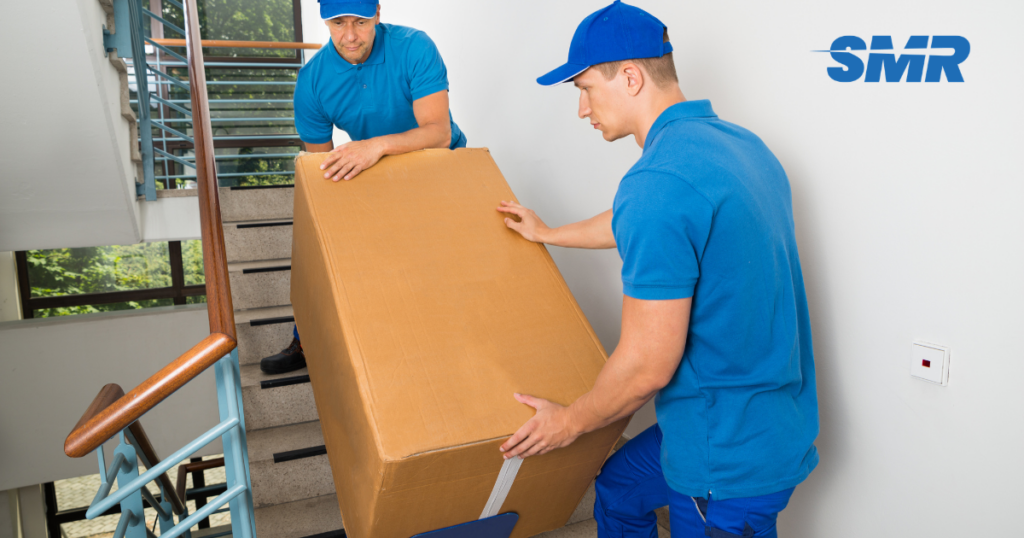 man with a van Gospel Oak cheap movers lifting sofa carefully indoors
