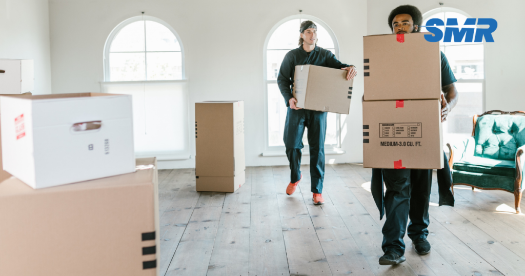 man with a van Greenford cheap movers carefully lifting furniture