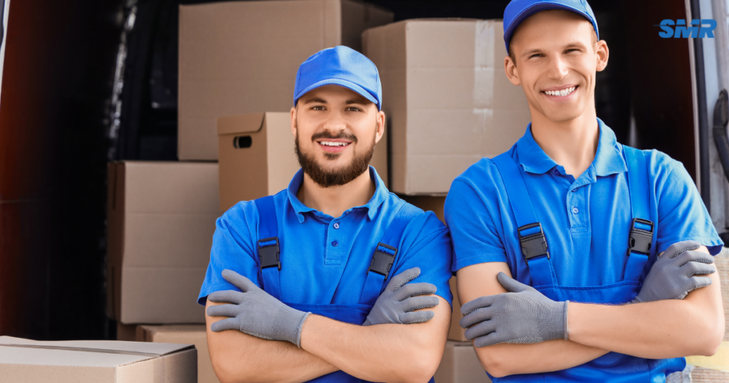 man with a van Greenford cheap movers lifting sofa carefully inside a home
