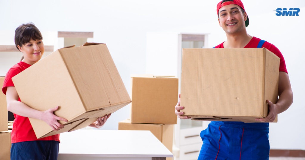 cheap man and van Hackney team loading boxes into van during house move