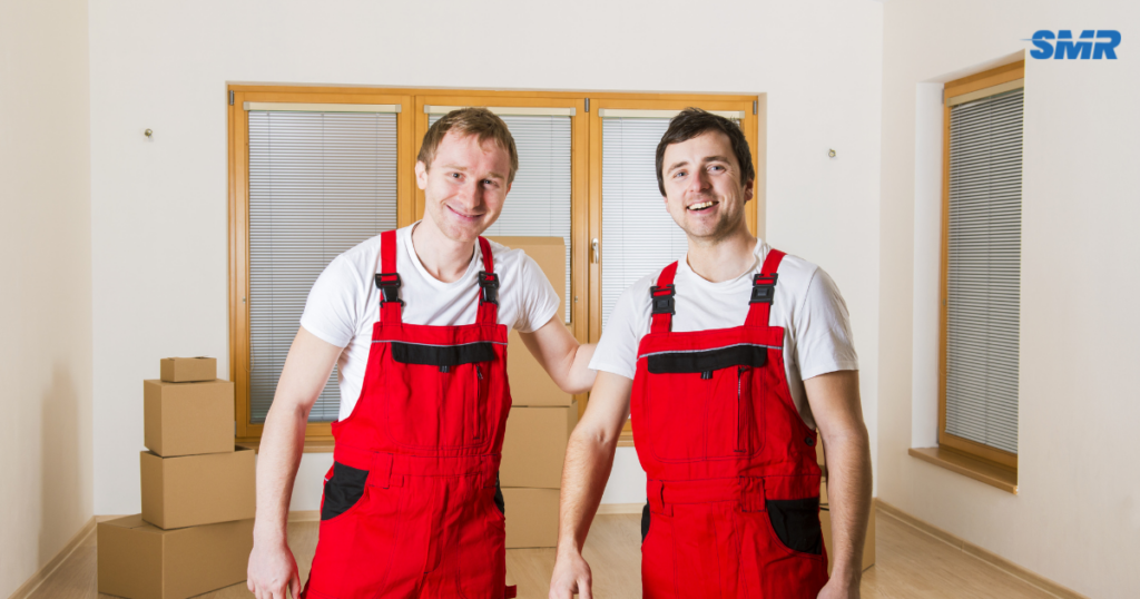man with a van Hackney cheap movers lifting sofa carefully indoors