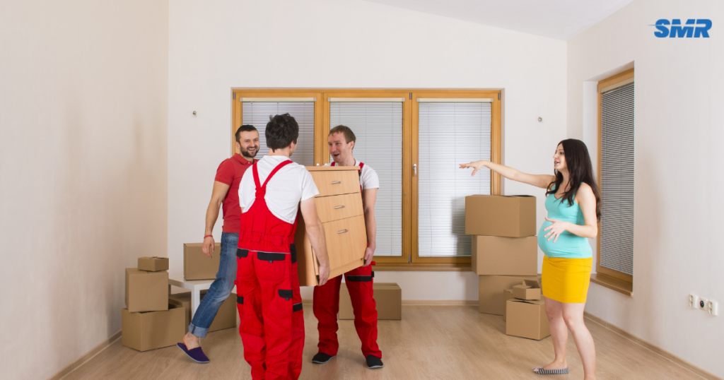 Professional movers carrying furniture during a house or flat move in Southgate