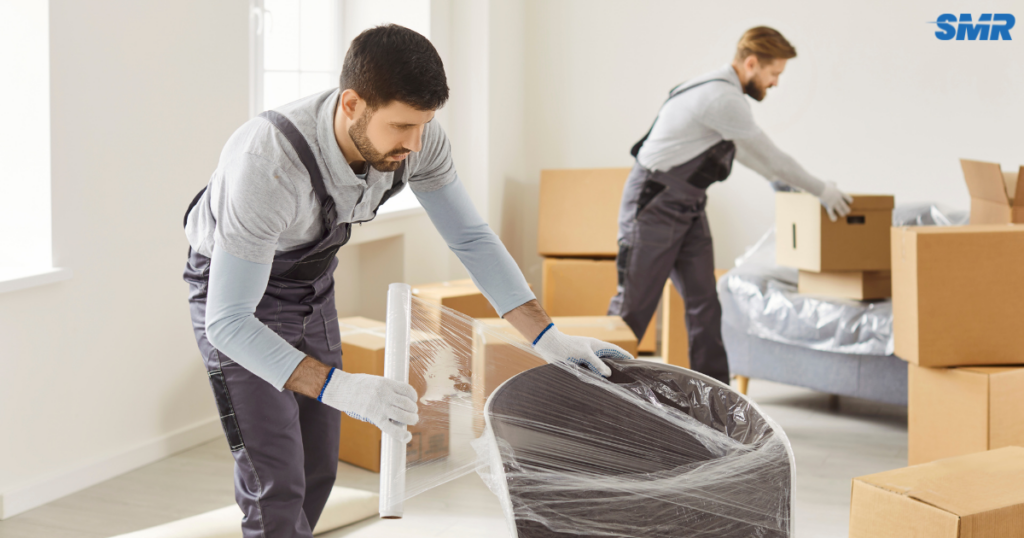 cheap man and van Elephant and Castle same day removals service with movers loading furniture into van