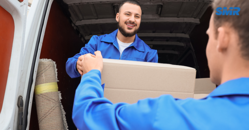 Smiling team members helping customers with man and van services in Greenford