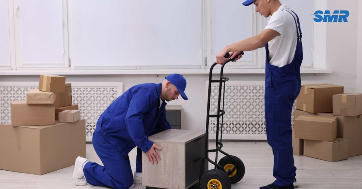 two movers arranging boxes on trolley in Grays RM17