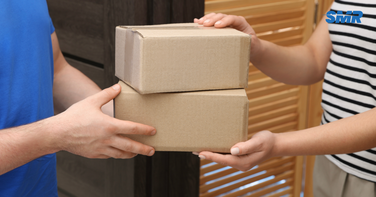 mover handing box to customer in Hackney