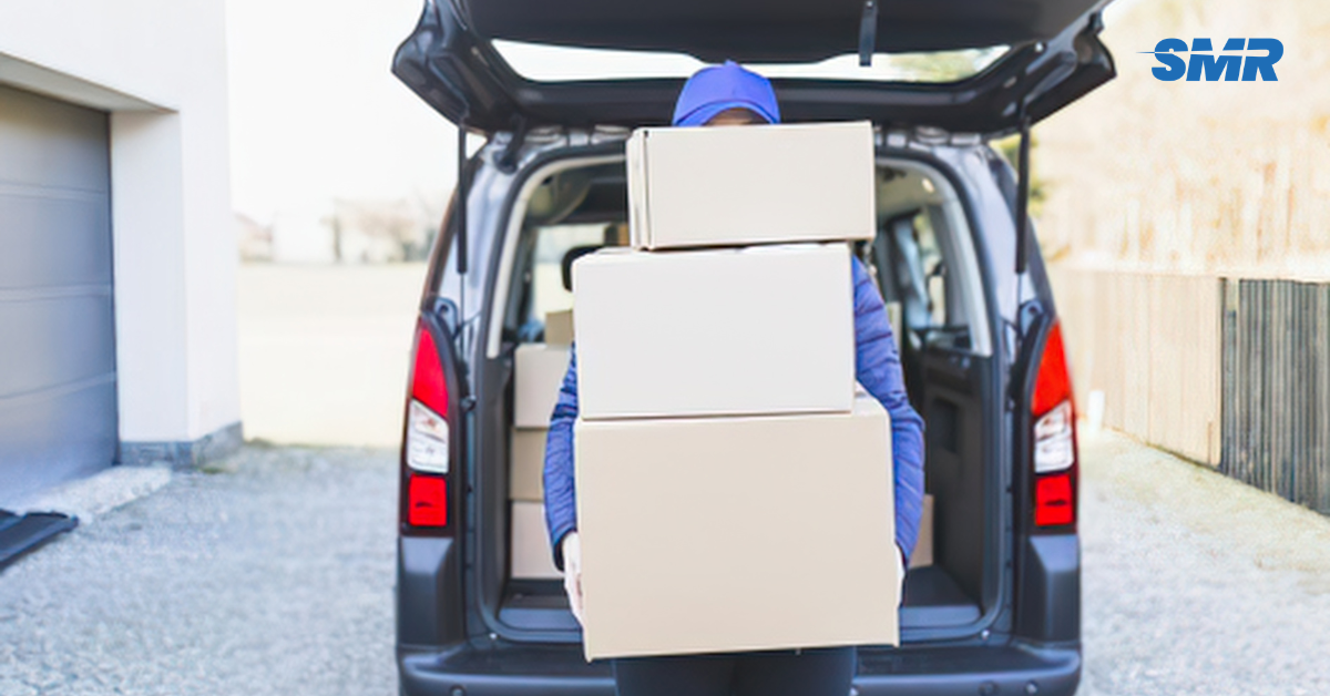 man and van in Bounds Green mover carrying box carefully for small removals