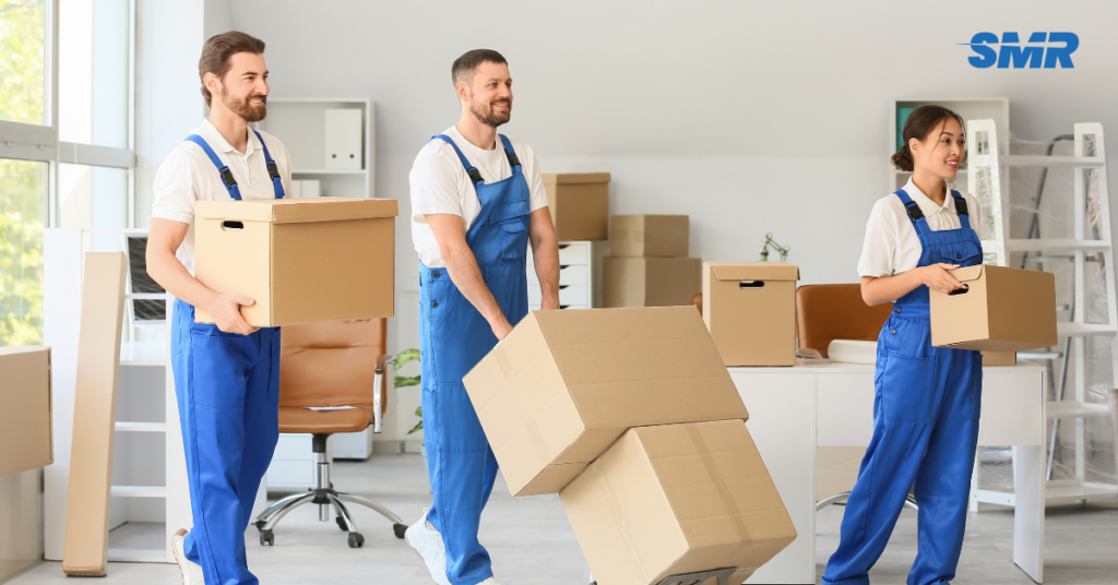 student moving boxes into van East Ham Park removals service
