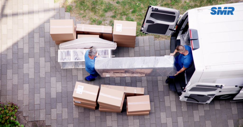 man and van Chelsea movers loading furniture into a van, reliable and affordable service