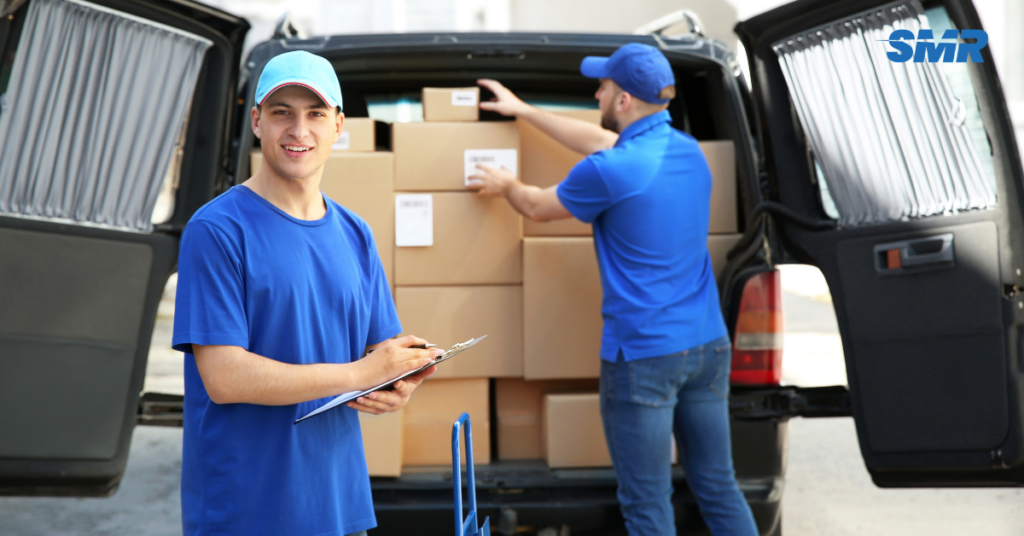 man and van Chingford loading boxes into a van, reliable and affordable moving service