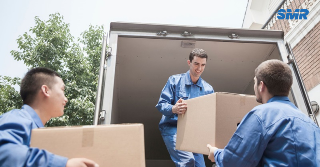 Sureman Removals van loading boxes outside a home in Southgate N14