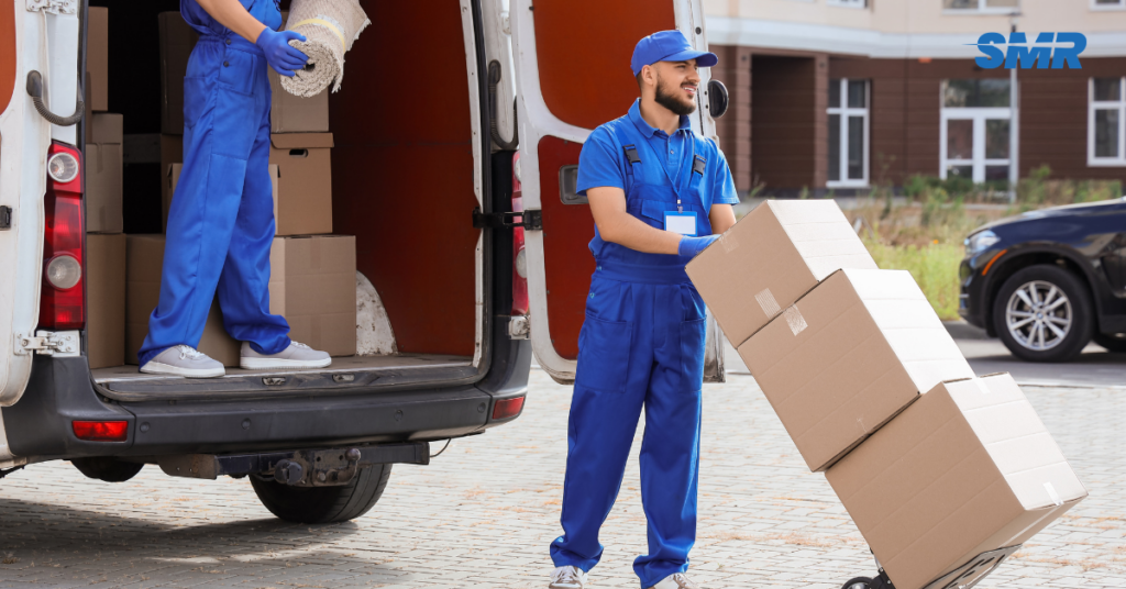 movers loading boxes and furniture into van in Crystal Palace SE19
