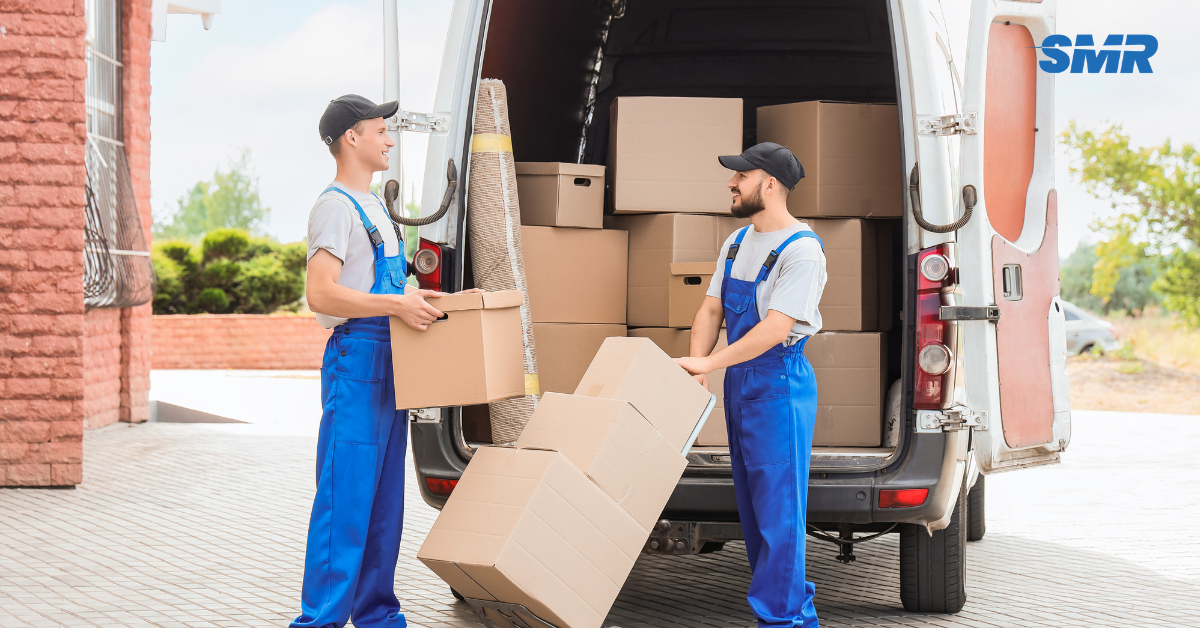 two movers arranging boxes on trolley in Greenwich SE10