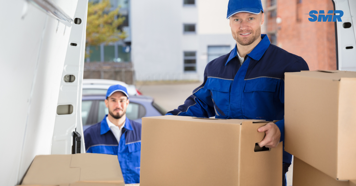 two movers loading boxes into van in Gunnebury W3