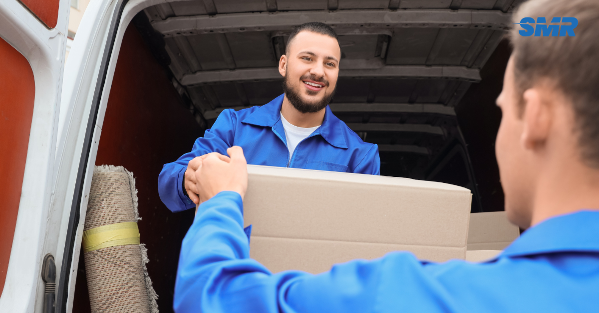 Cheap man and van Catford loading boxes with local landmarks in background