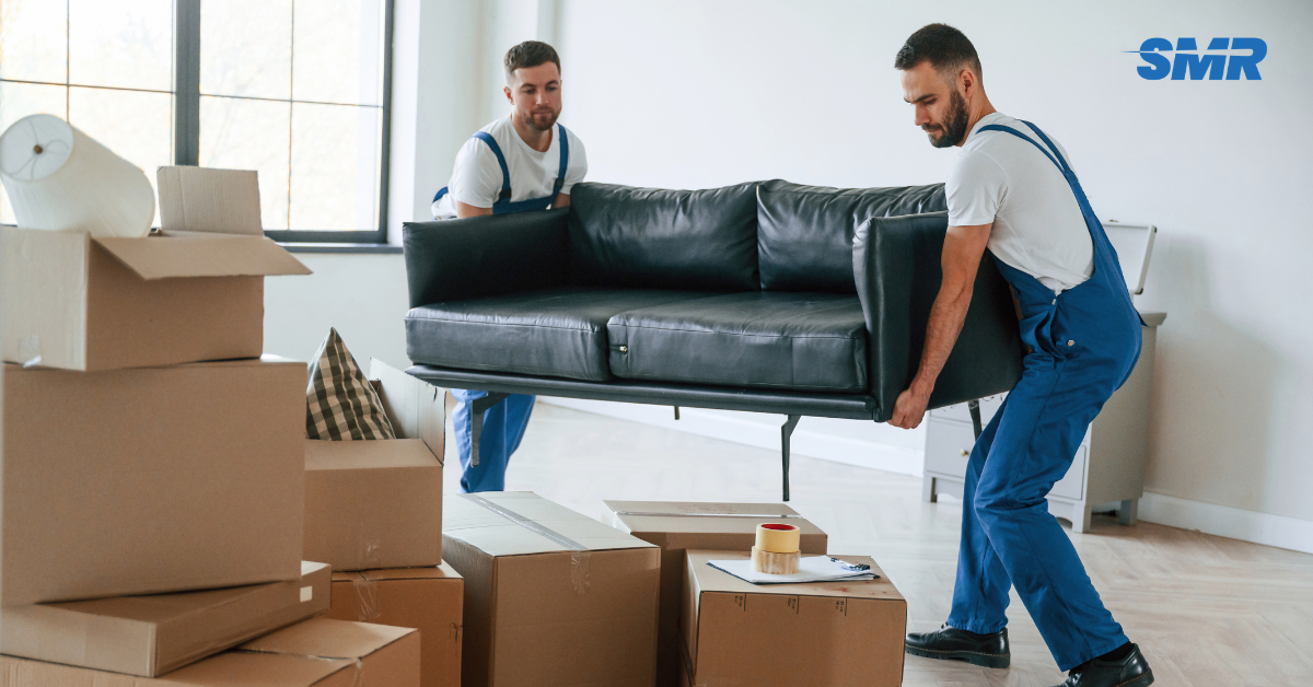 house removals Muswell Hill movers carrying sofa into van