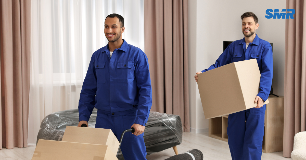 Mover carrying a single item into a Sureman Removals van in Newington