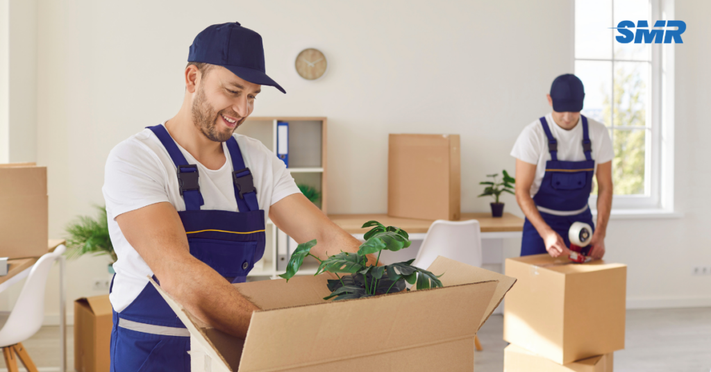 house removals Islington movers carrying sofa into home happy customer