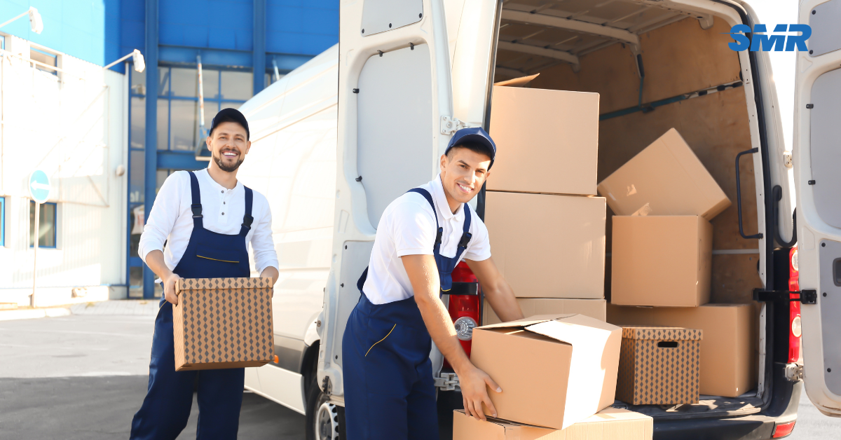 Man and Van Orpington team loading furniture into removals van outside house in BR5