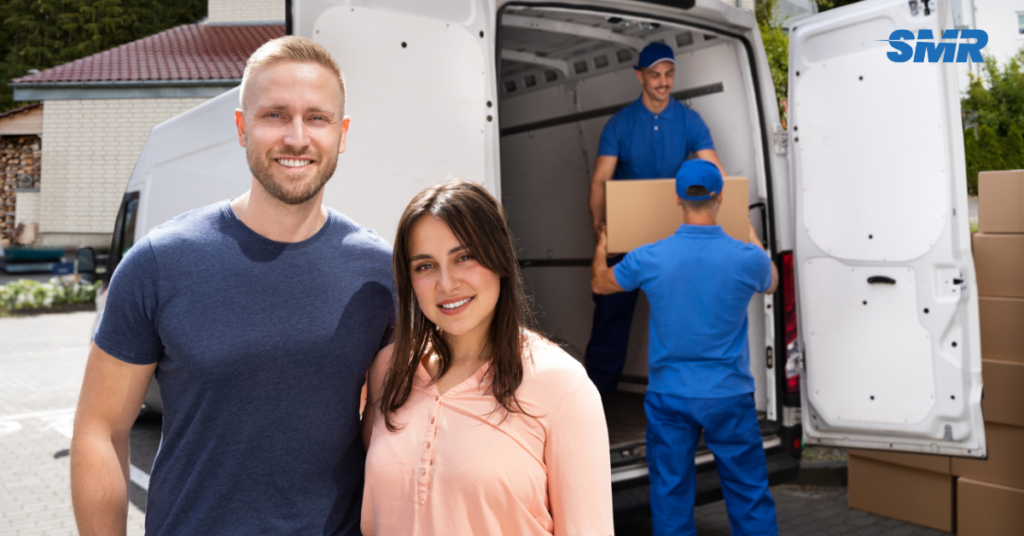 Man and van for single item Greenford movers carrying sofa into flat