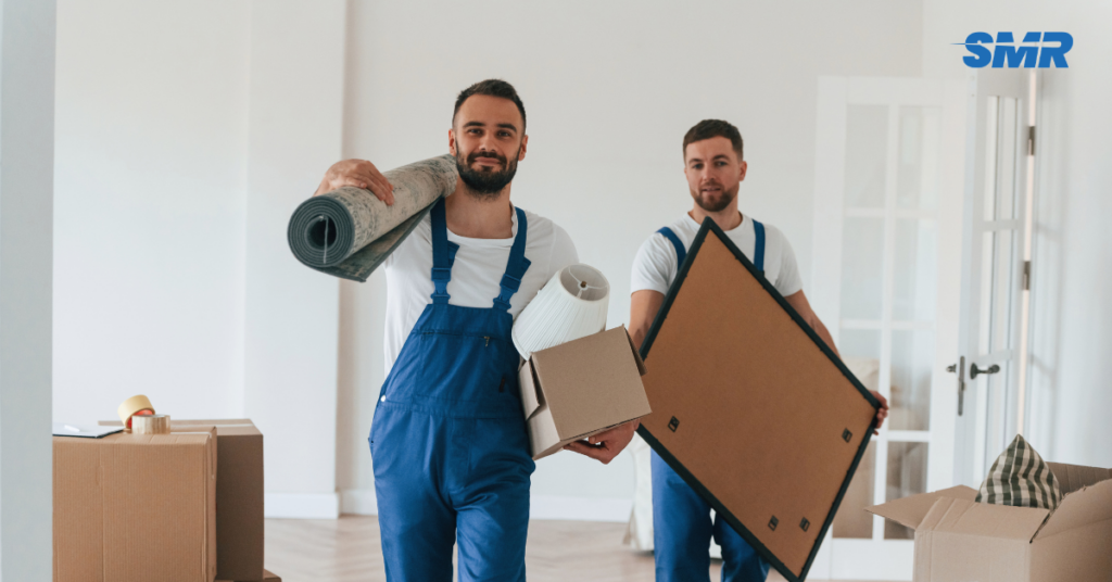 Same day man and van Stratford E11 mover carrying furniture to a removals van