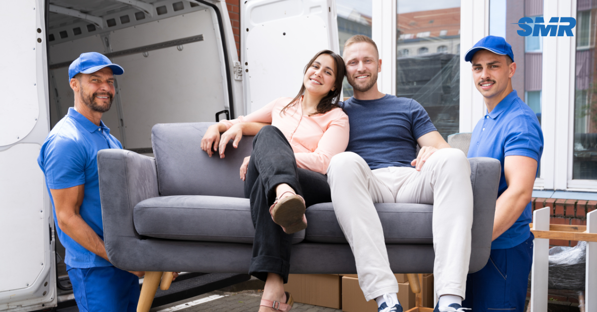 Man and Van Osterley movers loading furniture into removals van in TW7
