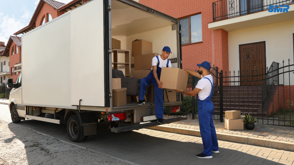 Man and van team in Wembley Park loading furniture and boxes into a removal van