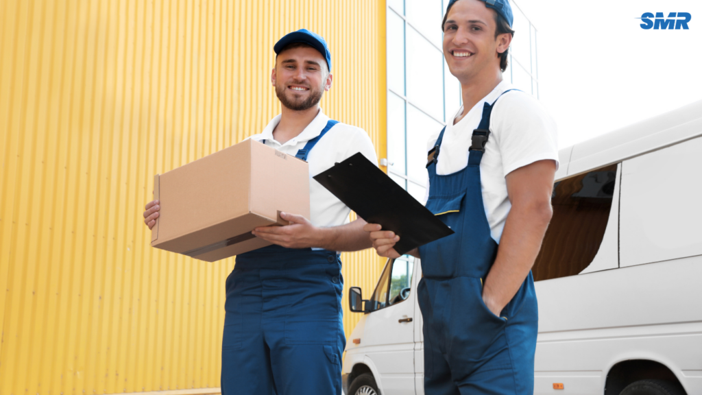 Movers unloading items from a van in Barking, London