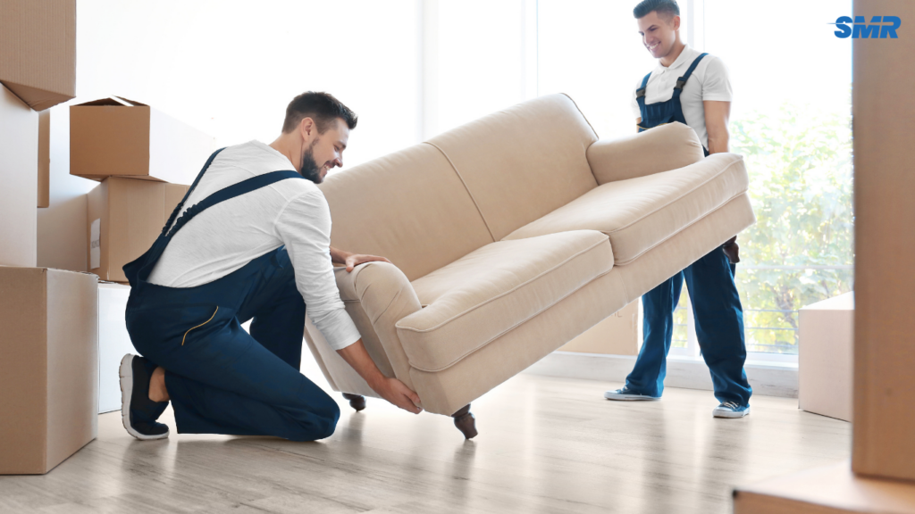 Mover carrying sofa for delivery service in Finsbury
