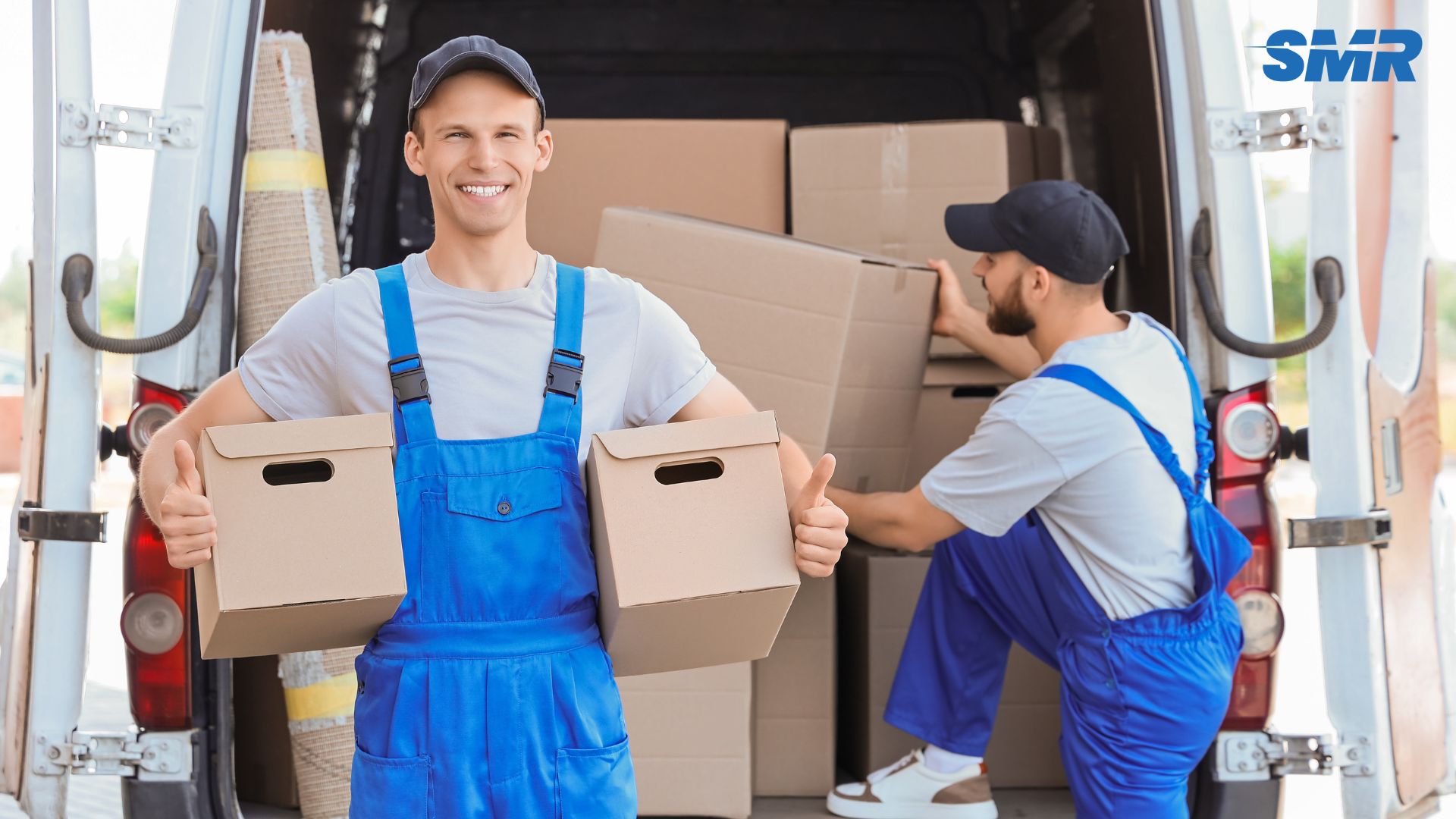 Man and van in Kentish loading furniture and boxes into a removal van.