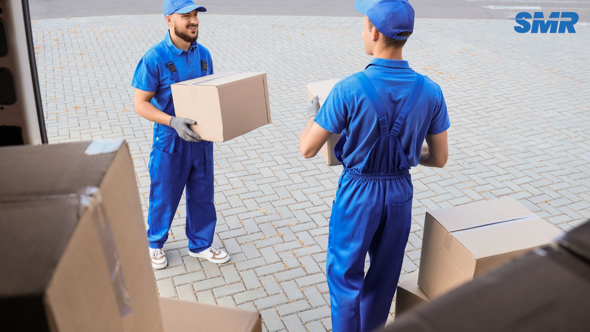 cheap man and van Burnt Oak loading boxes for house removals with local landmark