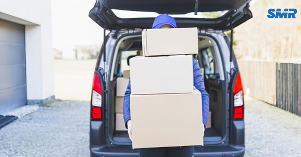 Same day Man and Van Stratford Removals mover carrying furniture to a removals van