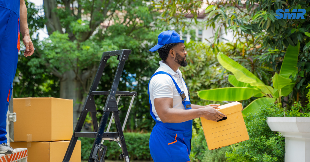 Experienced movers carrying furniture during a house removal in Ilford