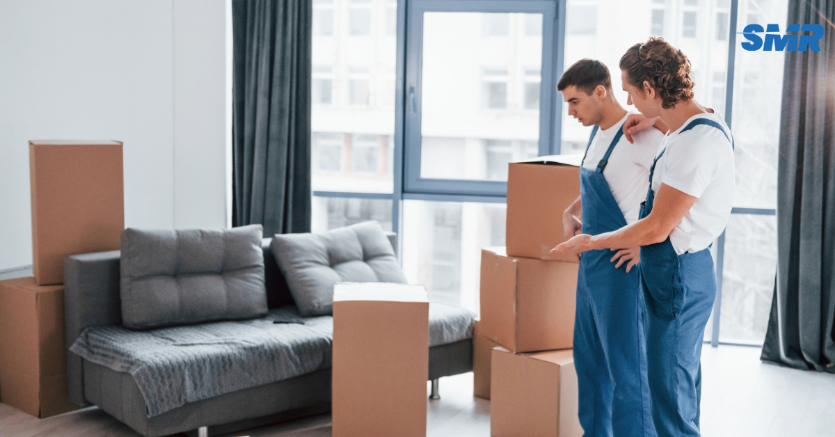 Experienced movers carrying furniture during a house removal in Islington